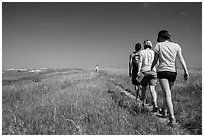 Hikers on Medicine Root Trail. Badlands National Park, South Dakota, USA. (black and white)