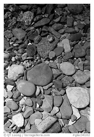 Colorful pebbles and shadow. Glacier National Park (black and white)