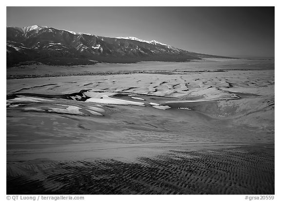 Sand dunes with patches of snow seen from above. Great Sand Dunes National Park and Preserve (black and white)