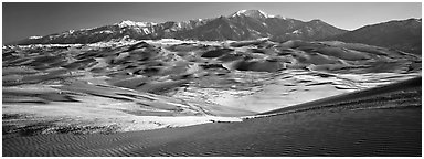 Landscape of sand dunes and mountains in winter. Great Sand Dunes National Park and Preserve (Panoramic black and white)