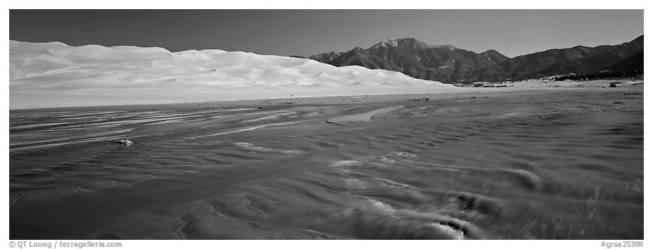 Wide shallow creek at the base of dune field. Great Sand Dunes National Park and Preserve (black and white)