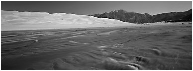 Wide shallow creek at the base of dune field. Great Sand Dunes National Park and Preserve (Panoramic black and white)