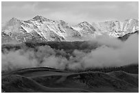 Snowy Sangre de Cristo Mountains and clouds above dune field. Great Sand Dunes National Park, Colorado, USA. (black and white)