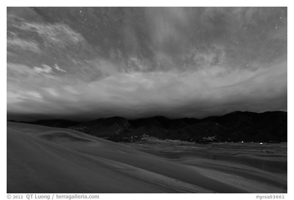Dunes and clouds at night. Great Sand Dunes National Park, Colorado, USA.