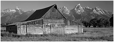 Wooden barn and mountain range. Grand Teton National Park (Panoramic black and white)