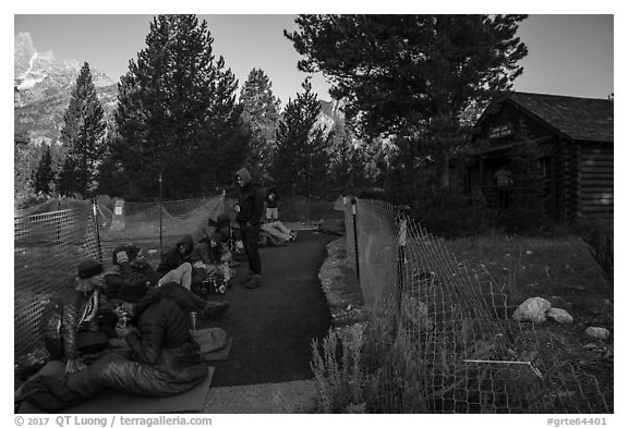 Hikers and climbers camped out in front of Jenny Lake Ranger Station for permits. Grand Teton National Park (black and white)