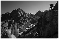 Mountaineer stands on rock looking at peaks, Garnet Canyon. Grand Teton National Park ( black and white)