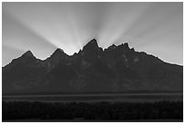 Crepuscular rays behind the Tetons. Grand Teton National Park ( black and white)