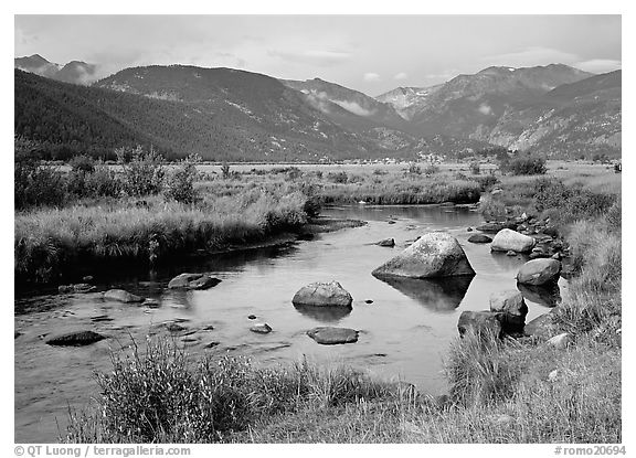 Creek, boulders, and meadow surrounded by mountains, autumn. Rocky Mountain National Park (black and white)