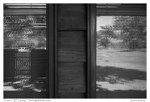 Meadow and parking lot, Medora Visitor Center window reflexion. Theodore Roosevelt National Park (black and white)