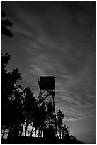 Rankin Ridge tower at dusk and starry sky. Wind Cave National Park, South Dakota, USA. (black and white)