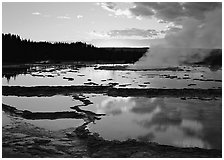 Great Fountain Geyser with residual steam at sunset. Yellowstone National Park, Wyoming, USA. (black and white)