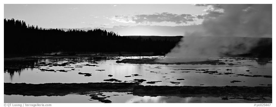 Steam rising in geyser pool at sunset. Yellowstone National Park (black and white)