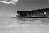 Split view of Fort Jefferson and clear sandy bottom. Dry Tortugas National Park, Florida, USA. (black and white)