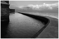 Seawall at sunrise. Dry Tortugas National Park, Florida, USA. (black and white)