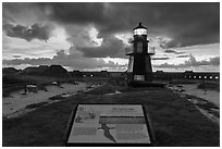 Interpretive sign, Harbor Light, and fort Jefferson. Dry Tortugas National Park, Florida, USA. (black and white)