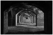 Gallery illuminated by last light inside Fort Jefferson. Dry Tortugas National Park, Florida, USA. (black and white)