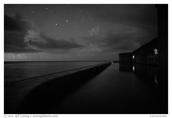 Fort Jefferson at night with stars and light from storm. Dry Tortugas National Park (black and white)