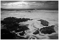 Waves breaking on volcanic rocks. Haleakala National Park, Hawaii, USA. (black and white)