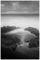 Surf, rocks, ocean and clouds, long exposure. Haleakala National Park, Hawaii, USA. (black and white)