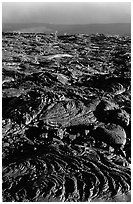 Hardened lava flow and Kaena Point. Hawaii Volcanoes National Park ( black and white)