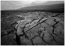 Fresh lava with cracks showing molten lava underneath. Hawaii Volcanoes National Park, Hawaii, USA. (black and white)