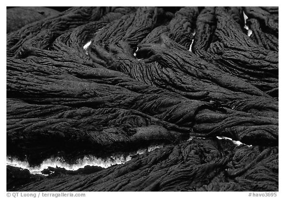 Close-up of ripples of flowing pahoehoe lava at dusk. Hawaii Volcanoes National Park (black and white)