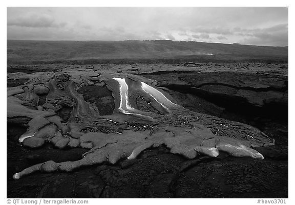 Molten lava flow at dawn on coastal plain. Hawaii Volcanoes National Park (black and white)