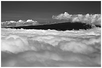 Mauna Loa emerging above clouds. Hawaii Volcanoes National Park, Hawaii, USA. (black and white)