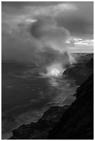 Coastline with steam illuminated by molten lava. Hawaii Volcanoes National Park, Hawaii, USA. (black and white)