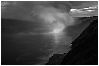 Coastline with steam lit by hot lava. Hawaii Volcanoes National Park ( black and white)