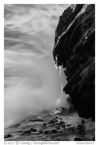 Molten lava drips into the sea. Hawaii Volcanoes National Park (black and white)
