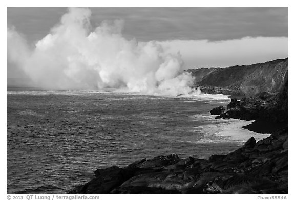 Clouds of smoke and steam produced by lava flowing into ocean. Hawaii Volcanoes National Park (black and white)