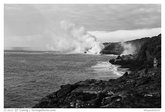 Hiker and volcanic steam cloud on coast. Hawaii Volcanoes National Park (black and white)