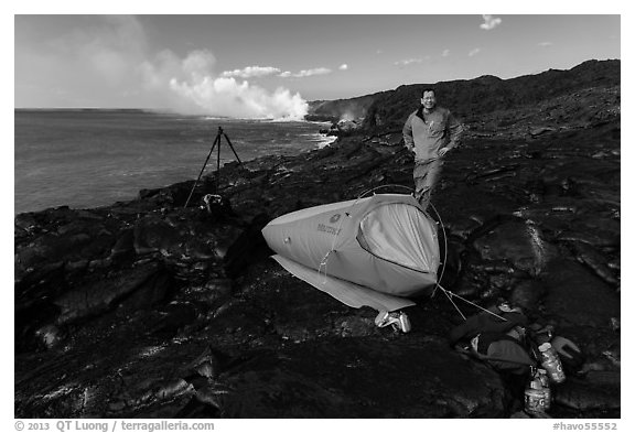 Photographer camping near lava ocean entry. Hawaii Volcanoes National Park, Hawaii, USA.