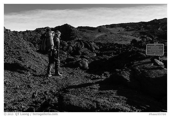 Backpacker entering park through Observatory Trail. Hawaii Volcanoes National Park (black and white)