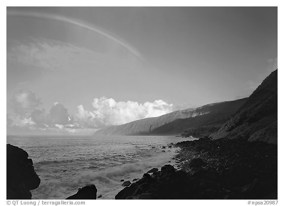 Rainbow and Mataalaosagamai sea cliffs in the distance, Tau Island. National Park of American Samoa (black and white)