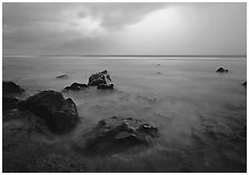 Rocks in water and approaching storm, Siu Point, Tau Island. National Park of American Samoa (black and white)