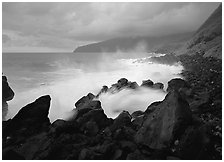 Stormy ocean and balsalt boulders, Siu Point, Tau Island. National Park of American Samoa (black and white)