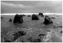 Boulders and approaching tropical storm, Siu Point, Tau Island. National Park of American Samoa ( black and white)
