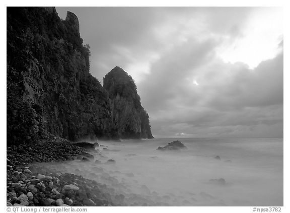 Peeble beach and Pola Island, stormy sunrise, Tutuila Island. National Park of American Samoa (black and white)