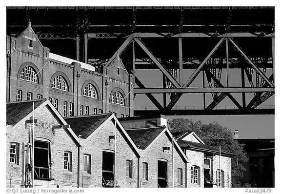 Colonial-era buildings of the Rocks and Harboor bridge. Sydney, New South Wales, Australia (black and white)