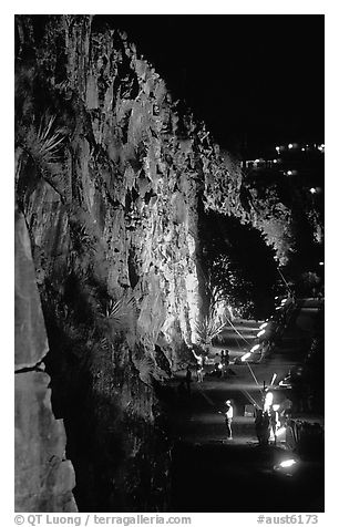 Rock climbing on the banks of the Brisbane River at night. Brisbane, Queensland, Australia (black and white)