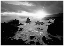 Sun and surf over rugged rocks, Kenae Peninsula. Maui, Hawaii, USA (black and white)