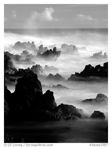 Rocks and waves at sunrise, Keanae Peninsula. Maui, Hawaii, USA (black and white)
