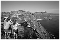 Family on the lookout on the summit of Makapuu head, early morning. Oahu island, Hawaii, USA (black and white)