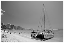 Catamaran and Waikiki Beach. Waikiki, Honolulu, Oahu island, Hawaii, USA (black and white)