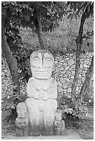 Marquesas statue and walls. Polynesian Cultural Center, Oahu island, Hawaii, USA (black and white)