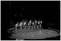 Wedding procession led by torch bearers performed by Tahitian dancers. Polynesian Cultural Center, Oahu island, Hawaii, USA ( black and white)