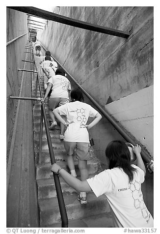 Women climbing a staircase on the Diamond Head summit trail. Oahu island, Hawaii, USA